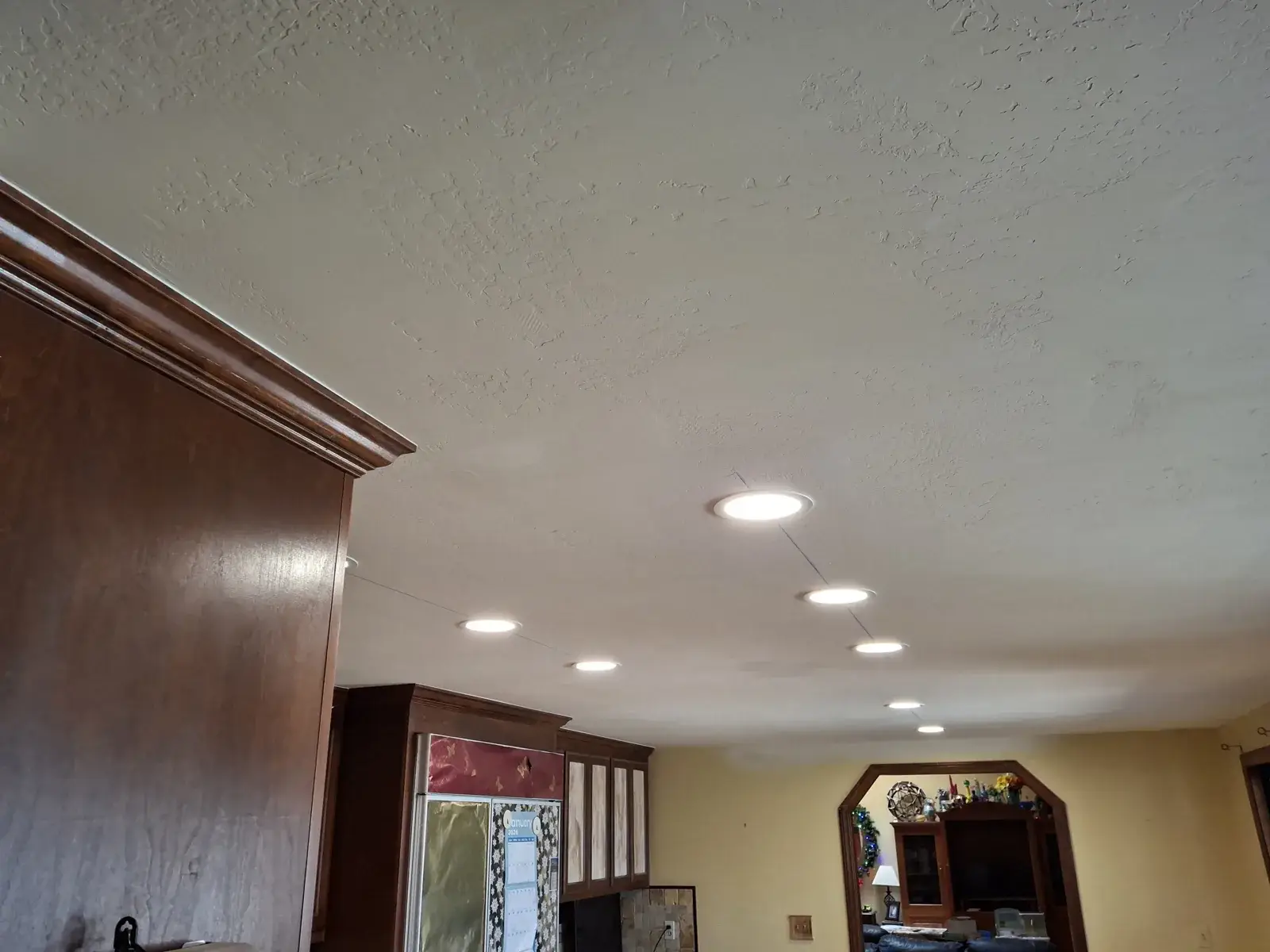 Repaired kitchen ceiling with new recessed lighting