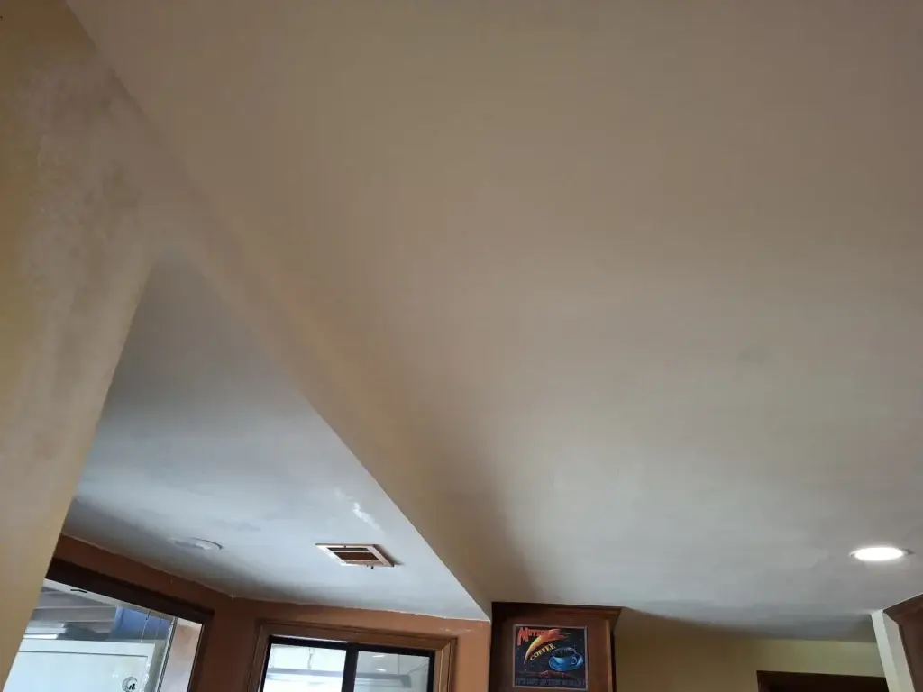 Repaired smooth ceiling over kitchen bay window