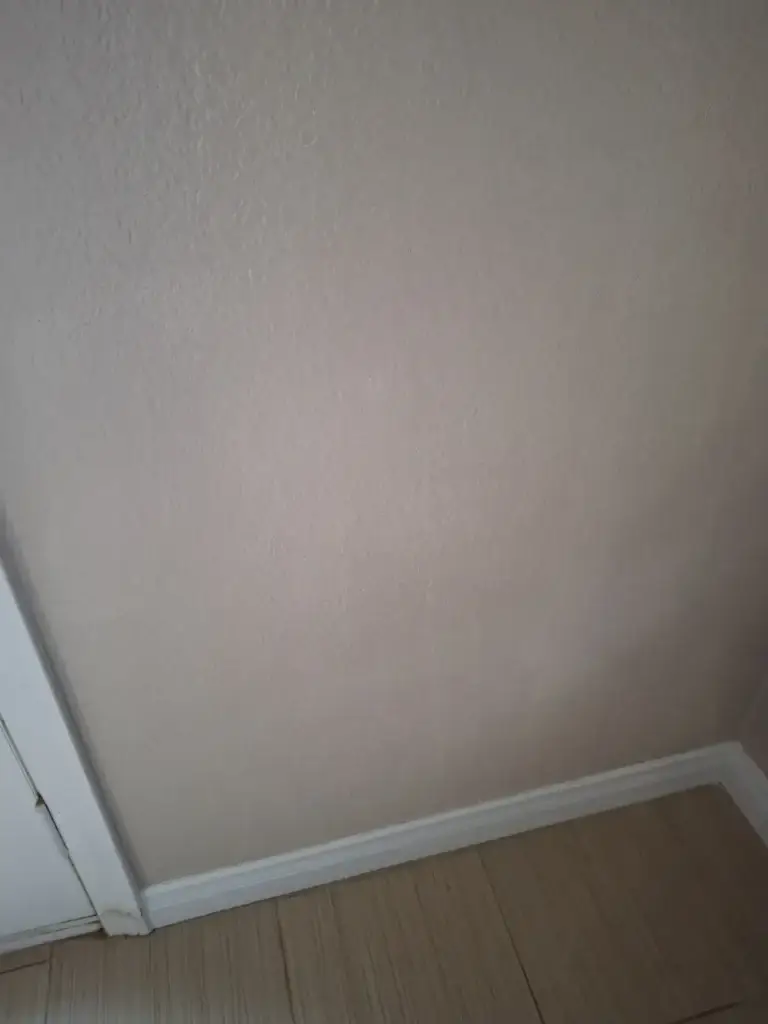 Repaired wall by door